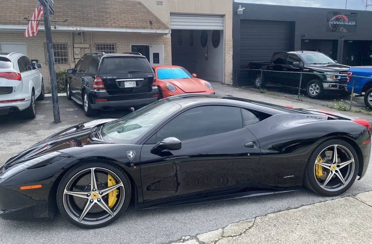 Black Ferrari 458 Italia outside 302 S Dixie Hwy, Gold Coast Collision Center, Pompano Beach