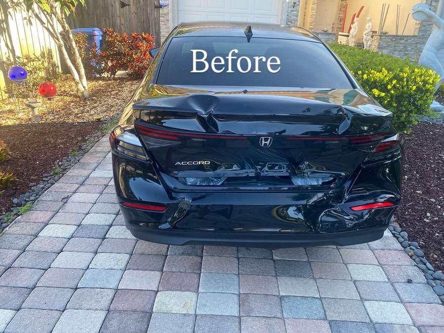 Black Honda Accord with rear-end collision damage before an insurance repair at Gold Coast Collision Center